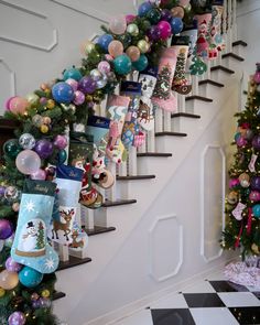 christmas decorations on the banisters and stairs in a house decorated with balloons, stocking and stockings