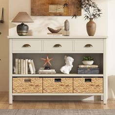 a white shelf with baskets and books on it