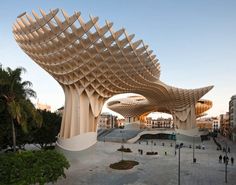 a large wooden structure in the middle of a courtyard