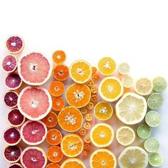 an assortment of citrus fruit cut in half