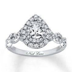 A pear-shaped diamond, surrounded by two rows of dazzling round diamonds, takes center stage in this elegant engagement ring from Neil Lane Bridal®. Ribbons of round diamonds weave together along the band, styled in 14K white gold. The ring has a total diamond weight of 1 1/8 carats. Available online while supplies last. Previously Owned Treasures are not eligible for in-store pick-up. Previously Owned Treasures may only be shipped either to your home address or to an alternate address. Price co Neil Lane Rings, Neil Lane Engagement Rings, Elegant Engagement Ring, Neil Lane, Elegant Engagement Rings, Diamond Weave, Pear Shaped Diamond, Diamond Stone, Round Cut Diamond