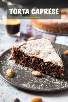 a slice of torta caprese cake on a plate with almonds around it