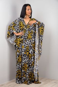 "V neck Kaftan Dress Oversized Women's Frock Maxi Dress Long loose fit dress with floral print  Funky Elegant Collection --> Produced by NUICHAN & Co   PRODUCT SIZE : One Size Fits Most * Chest : free up to 32 - 58\" * Waist : free up to 58\" * Hips : free up to 56\"  * Length : 58\" from shoulder to hem, measured laying flat - when hanging it measures up to 60\" ) * Sleeve length : 24\" MATERIAL  * ITY Polyester MODEL : * Model chest : 32\", waist : 24\" hips : 35\"  * Combined Height is 5\"6 > Black Printed V-neck Kaftan, Yellow Printed V-neck Kaftan, Flowy Printed V-neck Tunic, Oversized V-neck Floral Print Dress, Oversized Yellow Maxi Dress, Printed V-neck Free Size Kaftan, Flowy Yellow Tunic Kaftan, Free Size Floral Print V-neck Kaftan, Floral Print V-neck Free Size Kaftan