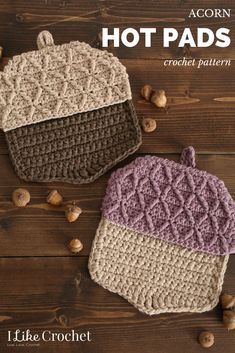 two crocheted pot holders sitting on top of a wooden table next to nuts