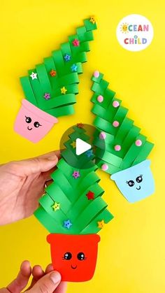 someone is making a christmas tree out of paper