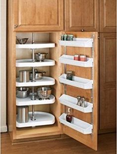 an open cabinet with several shelves in it