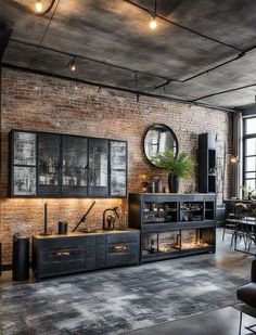 an industrial style living room with brick walls and exposed ceilings, black furniture and large windows