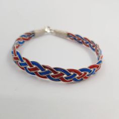 Front View of Real Silver Red&Blue Handknitted Mens Chain Bracelet Handmade Adjustable Red Chain Bracelet, Traditional Handmade Adjustable Chain Bracelet, Braided Bracelet Jewelry For Friendship, Silver Braided Jewelry For Friendship, Multicolor Braided Jewelry For Gifts, Red Braided Jewelry As A Gift, Multicolor Braided Jewelry Gift, Red Braided Jewelry Perfect As A Gift, Red Braided Jewelry For Gifts