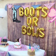 there is a birthday party with balloons and decorations on the table, along with boots or dolls