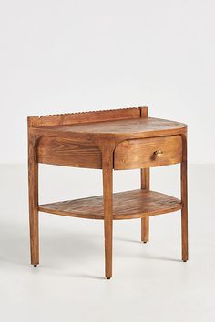 a small wooden table with one drawer on the bottom and an open shelf underneath it