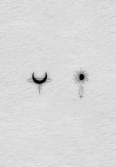 the sun and moon are drawn in black on white paper