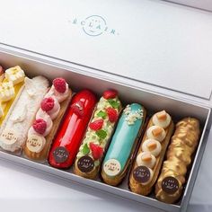 a box filled with lots of different types of pastries in it's packaging