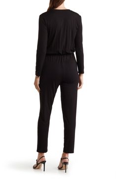 Crafted from stretchy modal, this long-sleeve jumpsuit keeps you looking stylish without sacrificing comfort. Split neck Long sleeves 90% modal, 10% spandex Hand wash, dry flat Imported Casual Long Sleeve Elastane Bodysuit, Black Elastane Jumpsuits And Rompers For Loungewear, Casual Elastane Bodysuit For Loungewear, Chic Long Sleeve Jumpsuits In Elastane, Stretch Jumpsuits And Rompers For Fall Loungewear, Long Sleeve Elastane Bodysuit For Loungewear, Casual Long Sleeve Elastane Jumpsuits And Rompers, Chic Long Sleeve Bodysuit For Loungewear, Stretch Long Sleeve Jumpsuits And Rompers