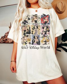 a woman wearing a white shirt with disney world pictures on it