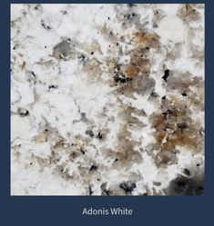 an image of white marble with brown and black spots on it's surface, as well as the words addons white