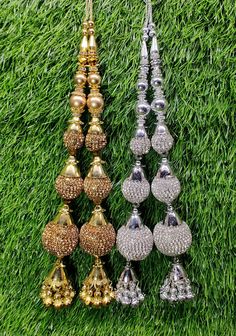 Indian Handmade Latkan Tassels for Saree Blouse Lehenga HandBags Hangings Dupatta Decoration Bridal Wedding dress for Women pair of 2 pcs Size - 22.00 cm Length  Item Description You can use this Beautiful pair of tassle for several DIY projects.  *These beautiful Tassel Latkans are used as the accessory for saree blouse on the back, but u can use according to your need and your innovative ideas. * Package contains 2 Latkan / 1 Pair Other Than Saree Blouse, you can use these latkans in various ways Craft Projects Designing Home Decoration Festive celebrations. Evening and party Apparels. Home décor items Apparel & Fashion Scarves n Stoles Headband, hats Table cover, curtains, Pillow covers, Cushion cover Shoe designing Headband, hats Table cover, curtains Designing stylish blouses Ship Fro Luxury Fusion Style Chandelier Earrings With Latkans, Cheap Festive Earrings With Latkans, Latkan Tassels Blouses Big And Heavy Accessories, Luxury Party Necklace With Latkans, Luxury Latkans Necklaces For Women, Luxury Necklace With Latkans For Gift, Cheap Wedding Chandelier Earrings With Latkans, Elegant Cheap Chandbalis With Latkans, Bollywood Style Sets With Stone Work For Wedding