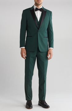 Bring understated elegance to the table in this three-piece tuxedo crafted from rich fabric in a classic single-breasted silhouette. Jacket has shawl collar; chest welt pocket; front welt pockets Vest has front button closure; V-neck Pants have zip fly with button closure; front slant pockets; back button-welt pockets Jacket and vest are lined; trousers are lined to the knee 65% polyester, 35% viscose Dry clean Imported Slim Fit Tuxedo Style Three-piece Suit, Slim Fit Three-piece Tuxedo Suit, Slim Fit Tuxedo Three-piece Suit With Notch Lapel, Tuxedo Style Three-piece Suit With Slim Fit, Single Button Tuxedo Style Three-piece Suit, Fitted Three-piece Suit With Notch Lapel For Semi-formal Occasions, Fitted Three-piece Suit With Notch Lapel For Semi-formal, Fitted Three-piece Notch Lapel Suit For Semi-formal, Fitted Three-piece Suit For Semi-formal Occasions