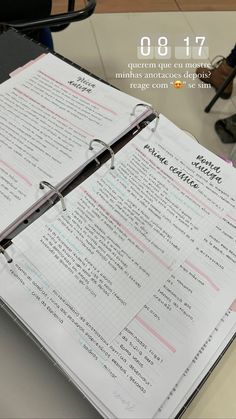 an open notebook sitting on top of a table