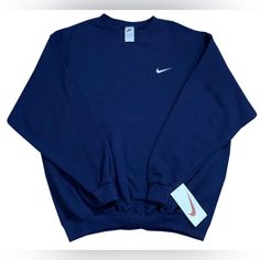 New With Tags, Sealed In Original Plastic -Length 31 Inches; Pit To Pit 27 Inches; Sleeve 24 Inches (Xl) Vintage Nike Swoosh Navy / White Crewneck Sweatshirt. If You Miss The Quality Of The 90s, Here Is Your Chance To Get This Never Tried Or Worn Before Navy Crewneck. The Swoosh Is Embroidered In White On The Heavy Duty Sweatshirt. Nike Crew Neck Athleisure Top, Nike Sportswear Crew Top, Nike Blue Crew Tops, Nike Sporty Crew Top, Nike Navy Sporty Sweatshirt, Navy Oversized Sporty Tops, Nike Navy Tops For Streetwear, Navy Crew Neck Sweatshirt, Navy Crew Neck Sweatshirt In Athleisure Style