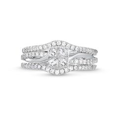 a white gold ring set with two rows of round cut diamonds on each band and an inter