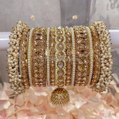 Large stack of luxurious antique Gold bangles with cream shades, jhumka drops and champagne zircon crystals make this the perfect stack for any Bride or those wanting to make a statement. Ready to Ship as pictured. Bangle Stack, Bangle Box, Bridal Necklace Set, The Bangles, Bangles Indian, Indian Jewelry Sets, Stacked Bangles, Jewelry Fashion Trends, Crystal Beads Bracelet