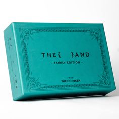 a teal colored box with the word,'the land family edition'on it