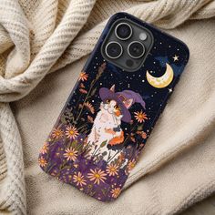 a phone case with an image of a cat on it and flowers in the background