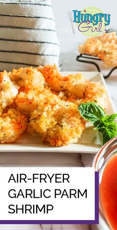 air - fryer garlic parm shrimp is served on a plate with dipping sauce