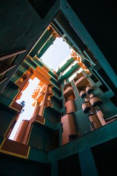 looking up at the inside of a tall building