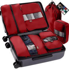 an open suitcase with four pieces of luggage in it