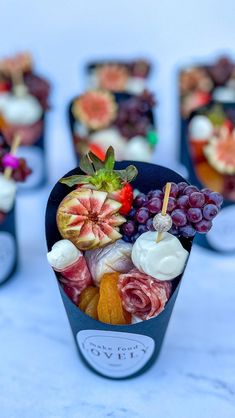 there are many different types of fruit in the cupcakes on the table together