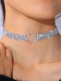 Diamond Love heart Choker Crafted from layers of cubic zirconia and joined with a love heart pendant. This piece is hand made using carefully selected cubic zirconia stones. Stand out from the crowd with this eye-catching and elegant piece that's guaranteed to shine brightly.  The perfect accessory at an affordable price. Size: Adjustable to fit all sizes Cheap Rhinestone Choker Jewelry, Luxury Heart Beads Jewelry For Wedding, Cheap Trendy Heart-shaped Choker, Cheap Heart-shaped Rhinestone Jewelry, Cheap Heart Beads Necklaces For Festivals, Cheap Heart-shaped Bling Jewelry, Cheap Clavicle Chain Jewelry For Valentine's Day, Luxury Heart Beads Necklaces For Wedding, Luxury Cubic Zirconia Heart Necklace For Formal Occasions