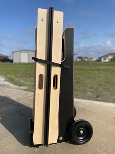 a pair of wooden doors sitting on top of a dolly