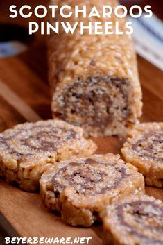 some kind of food that is on top of a wooden cutting board with the words scotcharoos pinwheels