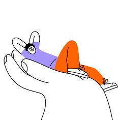 a hand holding an orange and purple object