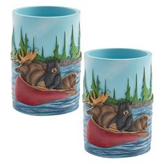 two mugs with animals on them floating in the water