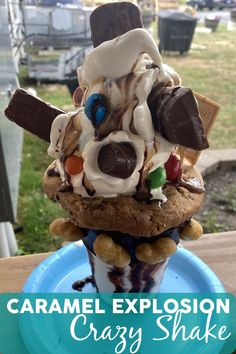 an ice cream sundae with chocolate, marshmallows and candy on top