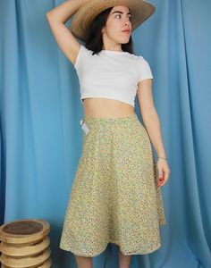 Original vintage wrap skirt in a ditzy blue, yellow and red floral print. Waist tie. Midi Length. UK 8 / Eur 36 Measurements - 26"/ 71cm waist - 36" / 92cm hips - 25" / 100cm length. Condition - Excellent Material - Cotton. Model is a UK size 8 and is 5'6" tall Beige Flowy Wrap Skirt For Spring, Spring Floral Print Midi Wrap Skirt, Floral Print Midi Wrap Skirt For Spring, Long Cream Skirt With Floral Print, Multicolor Floral Print Wrap Skirt For Spring, Spring Floral Print Long Wrap Skirt, Spring Floral Print Multicolor Wrap Skirt, Beige Floral Print Skirt For Day Out, Spring Multicolor Floral Print Wrap Skirt