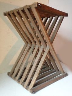 a stack of wooden boards sitting on top of a white table