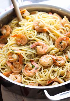 pasta with shrimp and parmesan in a skillet on the stove, ready to be eaten