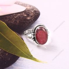 Natural Rhodonite Ring Natural Rhodonite Ring* Oval Pink Gemstone Ring *925 Sterling Silver Ring*Rhodonite Ring * Dainty  Ring* Oval Proposal Ring*Gift For Her*Gift Rings ✦Gemstone-Size-10x14 mm ✦Product: Ring ✦Main Gemstone : Rhodonite ✦Gemstone shape : oval ✦Metal: 925 sterling Silver ✦925 Stamped: Yes ✦Brand: Handmade <> Rhodonite  is a stone that integrates physical and spiritual energies, stimulating love and passion while energising the soul. Rhodonite opens the heart, lifting depression a Adjustable Oval Ruby Ring, Oval Natural Stone Rings For Anniversary, Oval Rings With Natural Stones For Anniversary, Oval Natural Stones Anniversary Rings, Elegant Oval Ruby Ring With Natural Stones, Oval Natural Stone Rings For Weddings, Oval Natural Stones Wedding Ring, Oval Natural Stone Wedding Ring, Oval Crystal Ring With Natural Stones For Promise