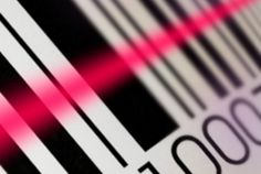 a bar code is shown with pink light coming from the top and bottom bars on it