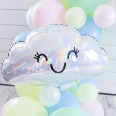 a bunch of balloons that have some kind of cloud on them