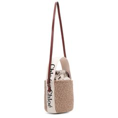 Brown raffia bucket bag with white detailing from Chloé. The Woody tote bag is handwoven from partly upcycled materials by independent craftswomen in Kenya. It features a drawstring fastening and a long leather strap for shoulder and crossbody wear. It is complete with an embroidered Chloé logo for graphic contrast and signature touch.Measurements: L17 x H16 x W16cmMade in Italy Raffia Bucket Bag, Chloe Logo, Upcycled Materials, Kenya, Bucket Bag, Leather Straps, Chloe, Hand Weaving, Tote Bag