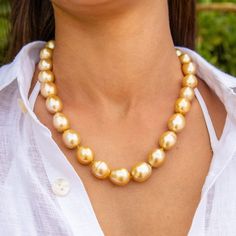 This listing is for one Adele Golden Strand Oval Shape Golden South Sea Pearls Rich Golden color Necklace is 20 inches long Made with 27 beautiful Golden South Sea Pearls Pearls are graduated from 14.6-16.6mm 14kt Solid Gold Ball clasp Knotted with Silk Thread Note: All of our Pearls are natural and therefore, one of a kind. Each pearl will have variations in color, shape and surface that may not be exactly as shown in the image. This makes each piece of jewelry truly unique! Comes with a beauti Luxury Polished Gold Beads Jewelry, Golden South Sea Pearls, Color Necklace, South Seas, Sea Pearls, South Sea Pearls, Silk Thread, Golden Color, Adele