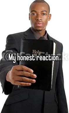 a man in a suit holding a book with the words my honest reaction