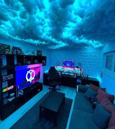 a living room filled with furniture and a flat screen tv mounted to the ceiling under a cloudy blue sky