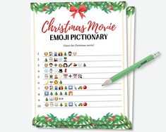 a christmas movie emojtionary is shown with a pen on top of it