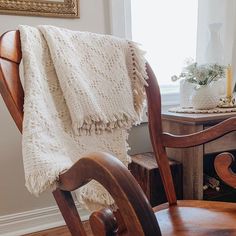 a chair with a blanket on top of it