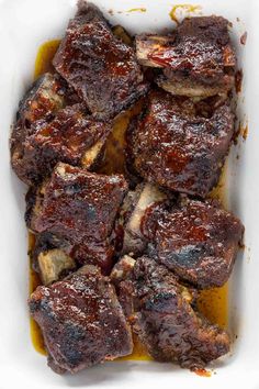 oven baked bbq beef short ribs in a casserole dish with text overlay